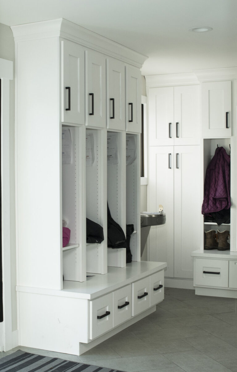 Utah mudroom built-ins with custom white locker cabinets, bench seating, and storage drawers for busy families.